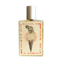 Introducing the Imaginary Authors A Whiff of Wafflecone - Large Size perfume, adorned with a silver cap. The label boasts an illustration of a tiger majestically perched atop an ice cream cone with a waffle pattern. The cone holds a delightful scoop of vanilla ice cream sprinkled with chocolate bits. This vintage-style design is framed by red decorative borders, evoking a nostalgic sense of sweet memories.