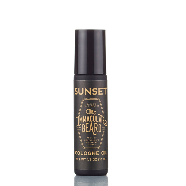 A 10 mL black bottle of The Immaculate Beard SUNSET Beard Oil with gold accents, phthalate-free and ideal for skin conditioning and daily use.
