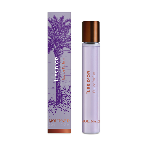 A Molinard Iles d'Or Eau de Parfum Roll-On stands beside its purple and copper box with a palm tree illustration. The slim bottle features a copper cap and lilac label, reflecting the elegant style of Molinard fragrances.
