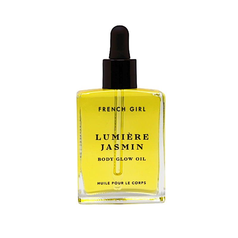 A clear glass dropper bottle of FRENCH GIRL Organic Hydrating Jasmine Body Oil (2 oz), filled with yellow oil, features black text on the front and a black dropper cap.