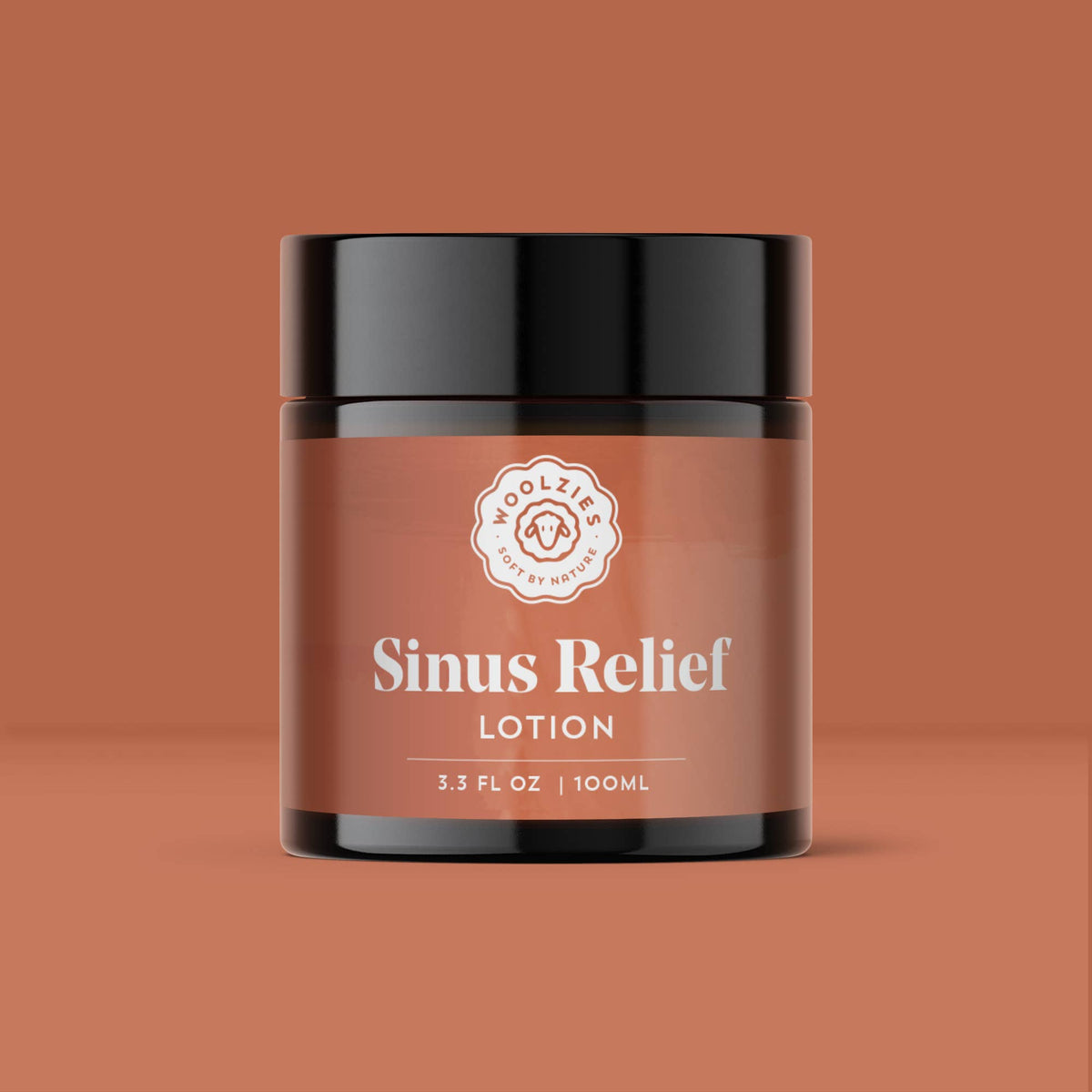 A brown jar with a black lid containing Woolzies - Sinus Relief Lotion enhanced with essential oils. The label reads "Sinus Relief Lotion" and indicates the volume as 3.3 FL OZ or 100ML. Infused with eucalyptus for clear breathing, the background is similarly colored to the jar, providing a cohesive look.