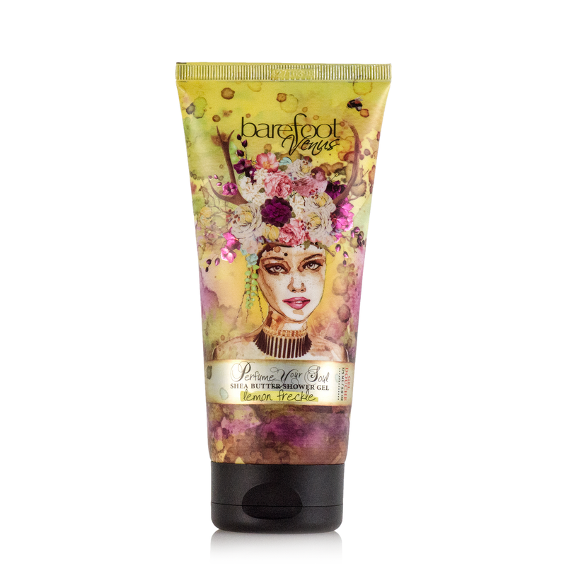 The Barefoot Venus Lemon Freckle Body Wash & Shower Gel is infused with creamy vanilla and plant-based ingredients, showcased in a colorful, artistic packaging featuring a woman's face adorned with floral elements. The vibrant design enhances its appeal as a natural body wash.