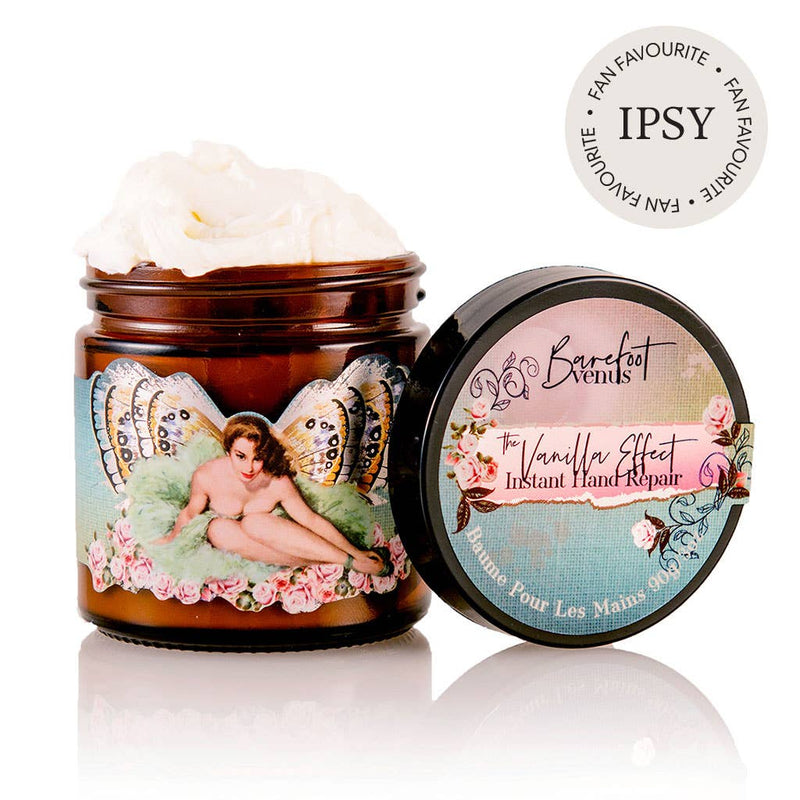 Barefoot Venus's The Vanilla Effect Instant Hand Repair Balm boasts a luxurious, creamy texture in its jar. The design features a winged woman surrounded by flowers and highlights that it is an "IPSY Fan Favourite." Crafted with a natural blend, this balm is formulated to nourish and heal.