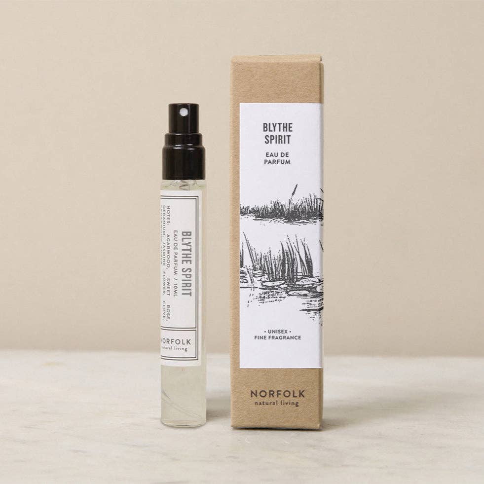 A 10ml glass spray bottle of Norfolk Natural Living Blythe Spirit Parfum stands beside its minimalist black-and-white rectangular box, both featuring Norfolk Natural Living branding.