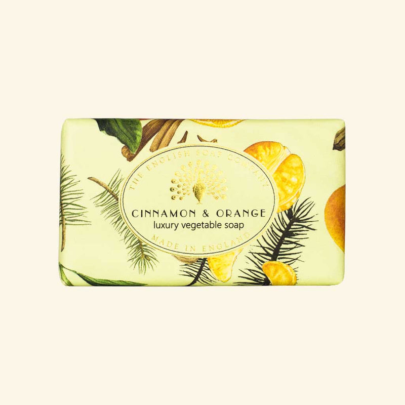 A bar of luxury vegan-friendly soap labeled "Cinnamon & Orange" with illustrated orange slices and cinnamon surrounded by pine needles, set against a light green background. Made in England.
Product Name: The English Soap Co. Cinnamon Orange Vintage Wrapped Soap
Brand Name: The English Soap Co.