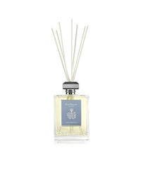 The Carthusia Mediterraneo Reed Diffuser - 230ml by Carthusia I Profumi de Capri features a clear glass bottle with a gray cap and white reeds, reflecting Italian minimalism and adding elegant fragrance to any space.