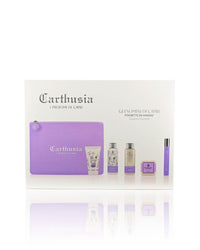 A Carthusia Gelsomini (Jasmine of Capri) Travel Clutch Bag by Carthusia I Profumi de Capri includes a small lavender-colored luxury travel clutch, mini perfume bottle, shower gel, body lotion, and soap bar, all elegantly packaged. The label reads "Gelsomini di Capri," indicating the Jasmine of Capri fragrance collection.