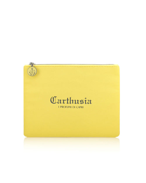 A small yellow zippered travel clutch with a silver zipper and a round silver charm. The front of the pouch is printed with "Carthusia I Profumi de Capri" in black text, perfect for carrying your favorite Carthusia I Profumi de Capri products infused with the Mediterraneo scent.