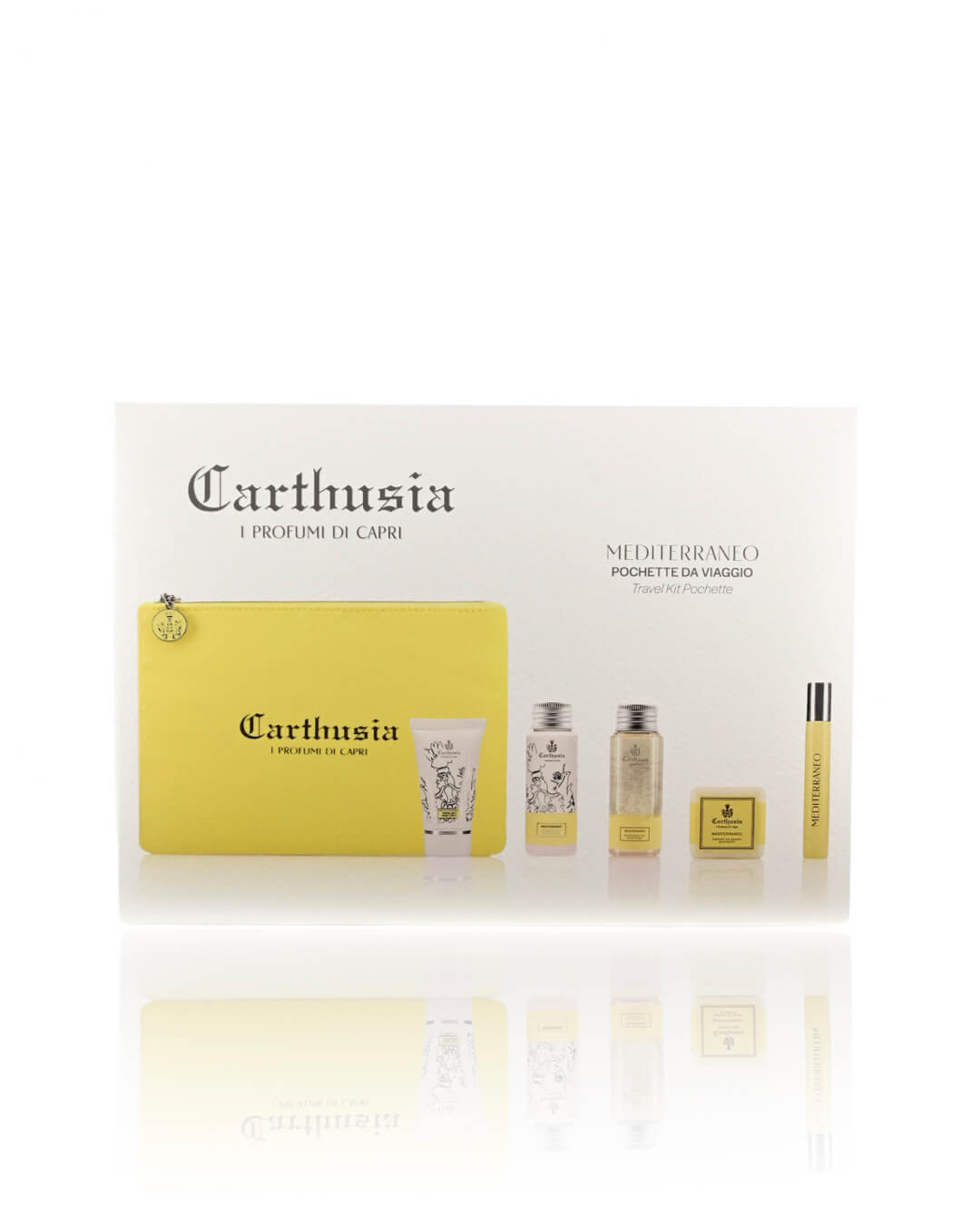 A Carthusia I Profumi de Capri gift set titled "Carthusia Mediterraneo Travel Clutch Bag" is displayed, featuring a yellow travel clutch. It includes shower gel, body lotion, perfume roll-on, and soap with the signature Mediterraneo scent, all reflected on a white background surface. The packaging showcases minimalist design and elegant black branding.