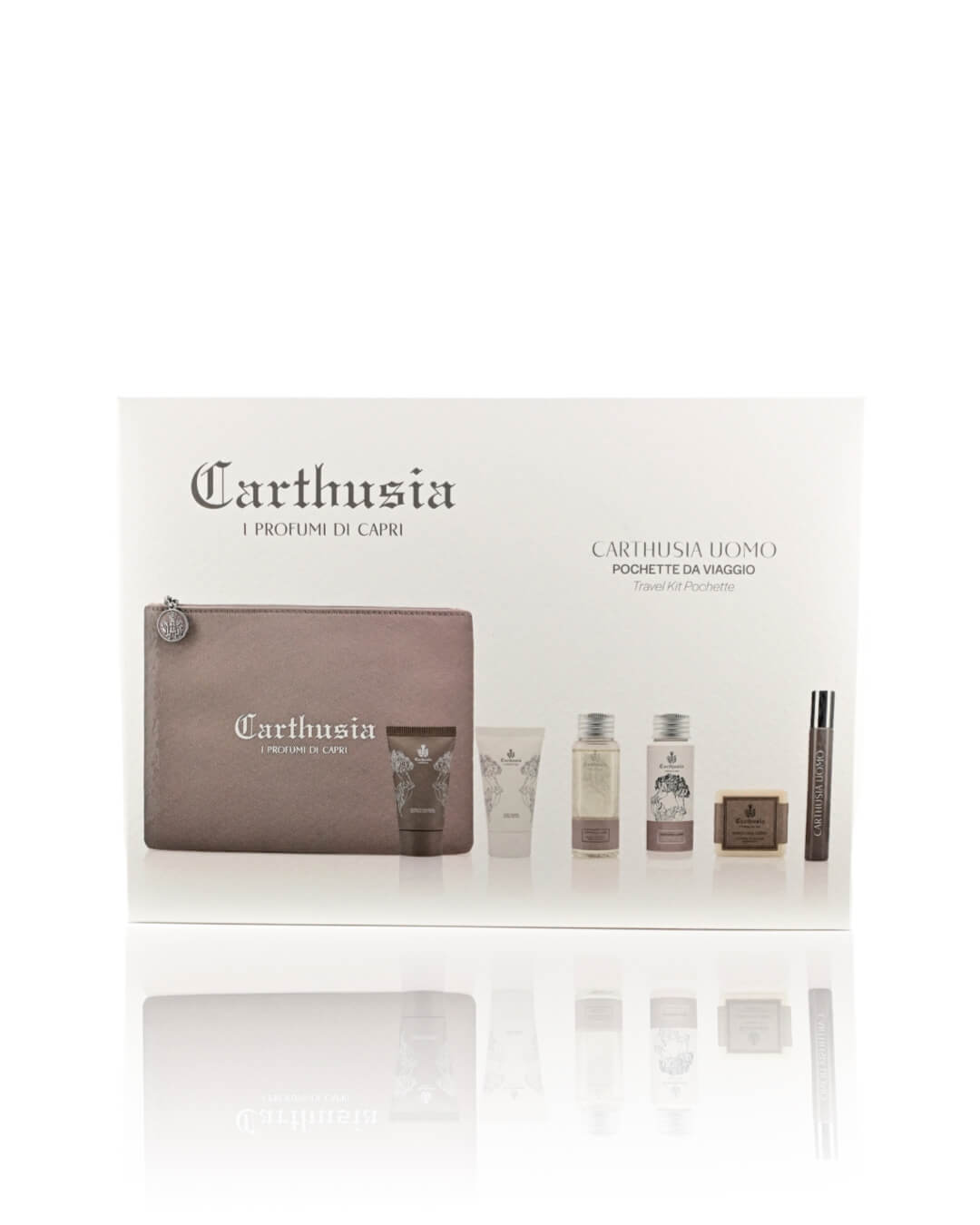 A gift set featuring a Carthusia I Profumi de Capri Carthusia Uomo Travel Clutch Bag in brown leather. The men's line includes toiletries: a shave cream, a bath gel, a fragrance bottle, a bar of soap, and a travel-sized spray. The items are displayed on a reflective white surface with Carthusia branding.