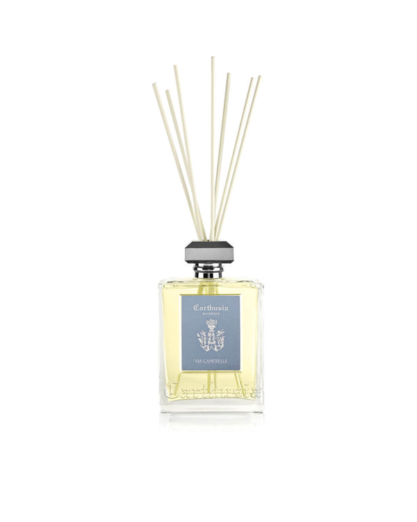 The Carthusia I Profumi di Capri Via Camerelle Reed Diffuser (230ml) features a square glass bottle with yellow liquid, gray cap, natural reeds, and a light blue label with emblem—ideal for elevating your home fragrance.