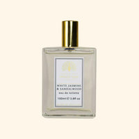 The English Soap Co. White Jasmine Eau de Toilette comes in a clear glass bottle with a gold cap and decorative logo, labeled "White Jasmine & Sandalwood eau de toilette, 100ml," a vegan fragrance made in England.