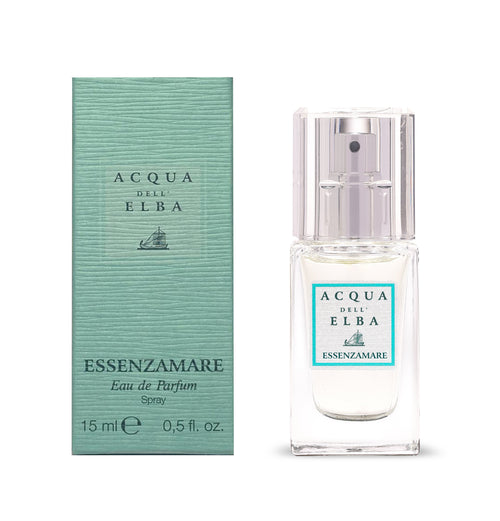 A 15ml Acqua dell'Elba Essenzamare EdP Travel Size stands by its turquoise box, both adorned with the brand’s logo and sailboat, reflecting the fragrance’s fresh floral marine character.
