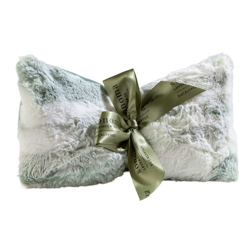 Plush and cozy, this soft white and mint pillow with a sage “Sonoma” ribbon is perfect for stress relief or pairing with the Sonoma Lavender Eucalyptus Snowmint Spa Mask for ultimate relaxation.