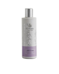A white bottle of Carthusia I Profumi di Capri Fiori di Capri Body Lotion features a silver cap, an elegant ornate logo, and a lavender-hued label that reflects its luxurious skin-nourishing benefits.