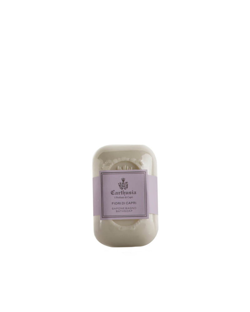 A white rectangular Carthusia Fiori di Capri Soap by Carthusia I Profumi de Capri, featuring an ornate design and lavender label, is shown on a plain white background. Suitable for sensitive skin.