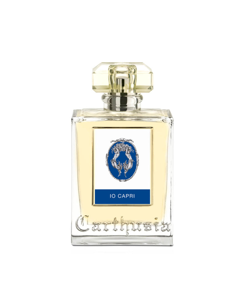 A Carthusia Io Capri Eau de Parfum - 100ml bottle with a transparent golden liquid, featuring a blue label with a white cameo and the text "io capri" on a white background, infused with the essence of wild fig.