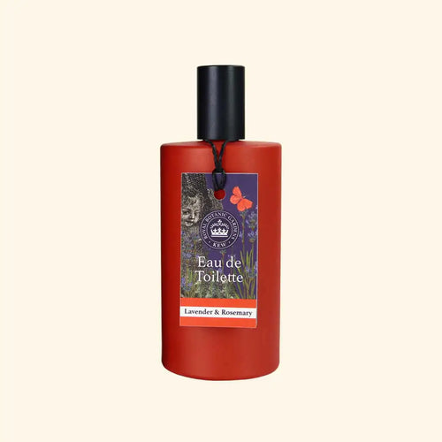 The English Soap Co. Kew Gardens Lavender and Rosemary Eau de Toilette is a vegan-friendly fragrance in a red bottle with black cap, featuring images of lavender, rosemary, a cat, and butterfly on the label against a beige background.
