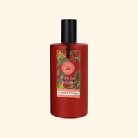 A red cylindrical bottle of The English Soap Co. Kew Gardens Bergamot and Ginger Eau de Toilette with a black cap features a floral label reading "Eau de Toilette" and "Bergamot & Ginger" against a light beige background.