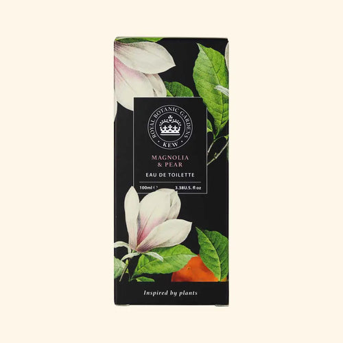 A rectangular box of The English Soap Co. Kew Gardens Magnolia and Pear Eau de Toilette, featuring magnolia flowers and green leaves on black, a central label, and product details—this vegan-friendly scent highlights English craftsmanship.