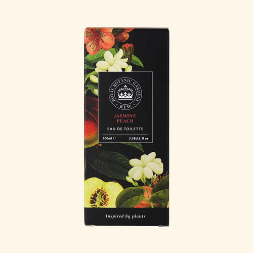 A rectangular box of The English Soap Co. Kew Gardens Jasmine Peach Eau de Toilette features floral and peach illustrations on a dark background, with "Inspired by plants" at the bottom, emphasizing this cruelty-free fragrance.
