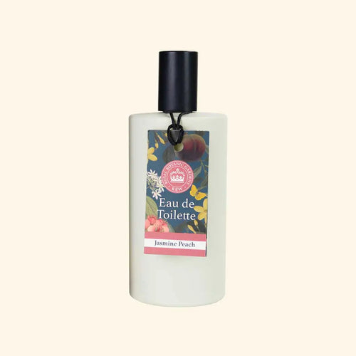 The English Soap Co. Kew Gardens Jasmine Peach Eau de Toilette is a vegan, cruelty-free fragrance in a white bottle with a black cap and floral label, featuring flower and peach illustrations.