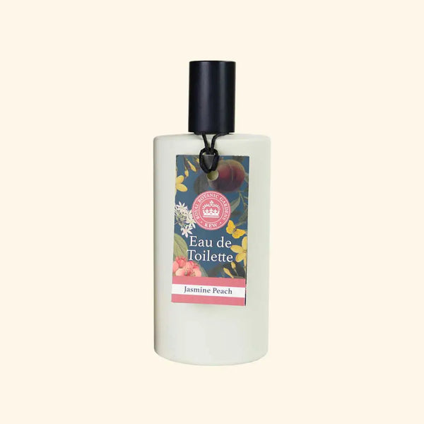 The English Soap Co. Kew Gardens Jasmine Peach Eau de Toilette is a vegan, cruelty-free fragrance in a white bottle with a black cap and floral label, featuring flower and peach illustrations.