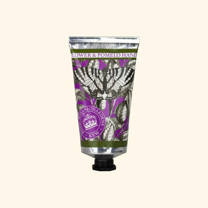 The English Soap Co. Kew Gardens Elderflower and Pomelo Hand Cream features botanical art, a butterfly, and purple-silver accents in a metallic tube with a round Kew Gardens logo, embodying artisanal, cruelty-free luxury.