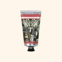 A silver and black floral tube of The English Soap Co. Kew Gardens Osmanthus Rose Hand Cream with a black cap, gold "Botanic Gardens KEW" seal, and pink label, displayed on a light beige background—luxury skincare from The English Soap Co.
