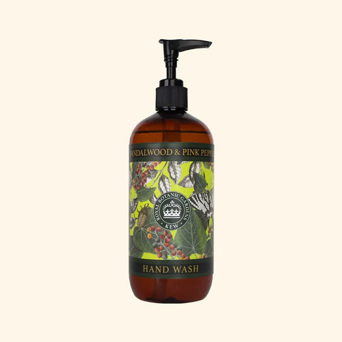 The English Soap Co. Kew Gardens Sandalwood and Pink Pepper Hand Wash comes in a brown pump bottle with a botanical and butterfly design, bearing the Royal Botanic Gardens, Kew emblem—an elegant vegan hand wash for daily luxury.