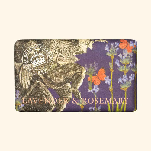 A rectangular, vegan-friendly soap bar from The English Soap Co.'s Kew Gardens collection, featuring Lavender and Rosemary scent, set against a purple background. Adorned with intricate illustrations of lavender sprigs, red butterflies, and a vintage botanical design. The text reads "LAVENDER & ROSEMARY," with a seal at the top left indicating "Royal Botanic Gardens, Kew.