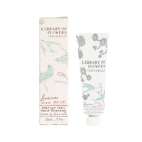 A tube and a box of Margot Elena's Library of Flowers True Vanilla Petite Treat Handcreme, enriched with Cocoa Butter, labeled "true vanilla," illustrated with botanical and bird drawings, on a white background.