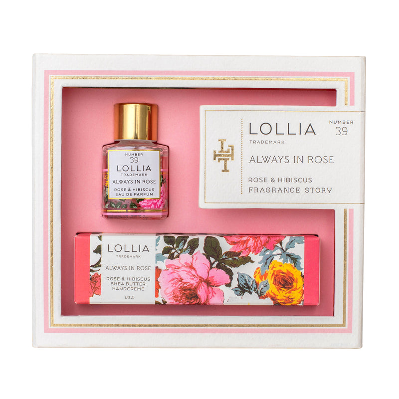 The Lollia Always in Rose Fragrance Story Gift Set by Margot Elena features a bottle of rose & hibiscus eau de parfum and a tube of luxurious shea butter handcreme, all packaged with floral designs and a pink border.