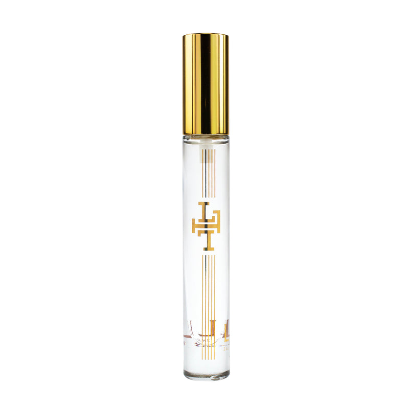 An elegant, clear glass Margot Elena Lollia Relax Travel Eau de Parfum perfume bottle with a gold cap and a white label featuring a double-line logo. The bottle is displayed against a white background.