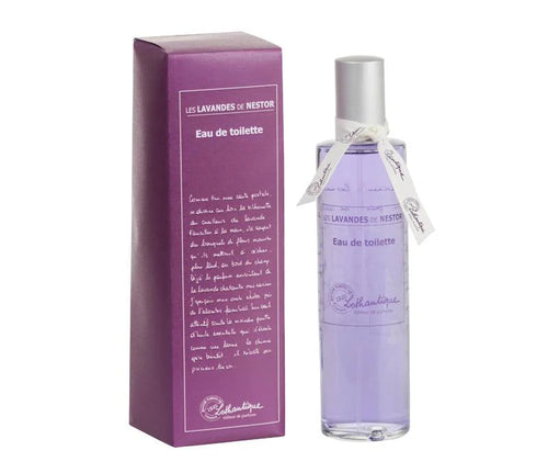 A tall, slender bottle of Lothantique's lavender eau de toilette, adorned with a silver cap, stands elegantly next to its matching box. Both showcase the refined white text and logo of "Lothantique," capturing the essence of Provence Lavender in every fragrant drop.