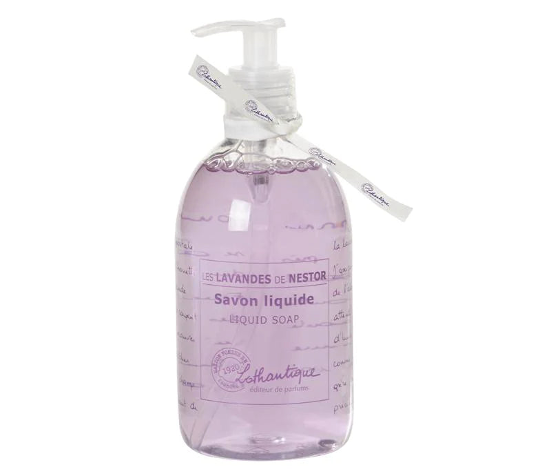 A transparent pump bottle of Lothantique les lavandes de l'oncle Nestor lavender liquid soap in elegant script, filled with purple Provence Lavender liquid, and adorned with a