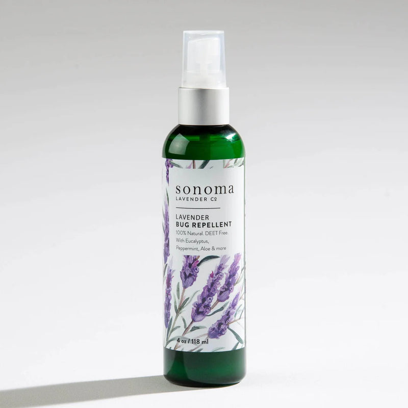 A green bottle of Sonoma Lavender Bug Repellent Spray by Sonoma Lavender with a spray nozzle, featuring lavender art and label text highlighting its 100% natural, DEET-free botanical formula with peppermint, aloe, and eucalyptus.