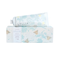 The Fast Bundle Lolia Wish Parfum Bundle features a tube of shea butter handcream (4 oz) atop its matching decorative box with light blue floral designs, gold accents, and descriptive text.