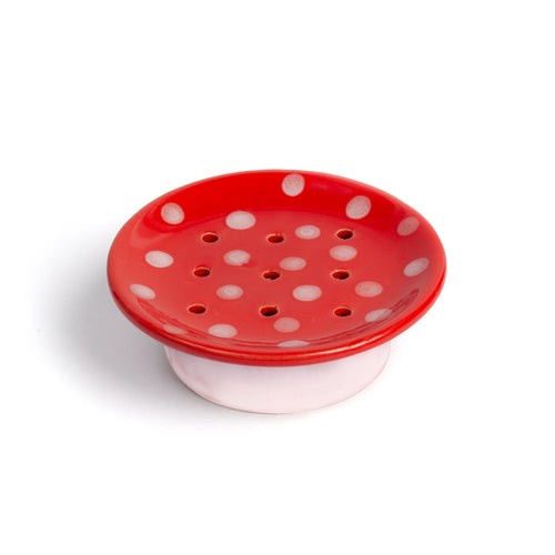 Kala’s Swedish Dream Red Mushroom Ceramic Soap Dish features a round red design with white polka dots and drainage holes on a white base, beautifully photographed against a white background.
