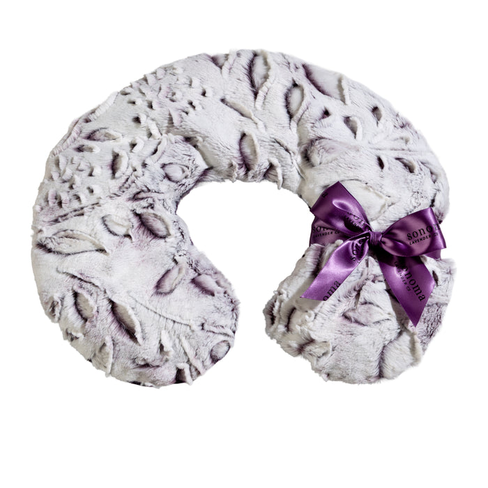 The Sonoma Lavender Iced Plum Neck Pillow by Sonoma Lavender features a plush, light purple design with a textured leaf pattern, U-shape, and is accented with a purple ribbon bow on one side.