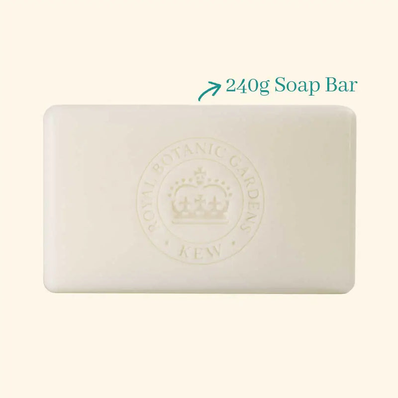 A large rectangular white vegan-friendly The English Soap Co. Kew Gardens Osmanthus Rose Soap bar with an embossed crown and “Royal Botanic Gardens Kew.” Text beside it reads “240g Soap Bar” with an arrow pointing to the bar.