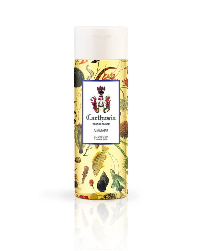 A bottle of Carthusia I Profumi de Capri A'mmare Shower Oil with Jojoba oil, featuring a colorful botanical and fruit patterned label on a white background.