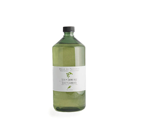 A large green-tinted plastic bottle with a black cap and white label, containing lot Belle de Provence Olive & Cucumber-Basil Liquid Soap Refill, is placed against a plain white background.