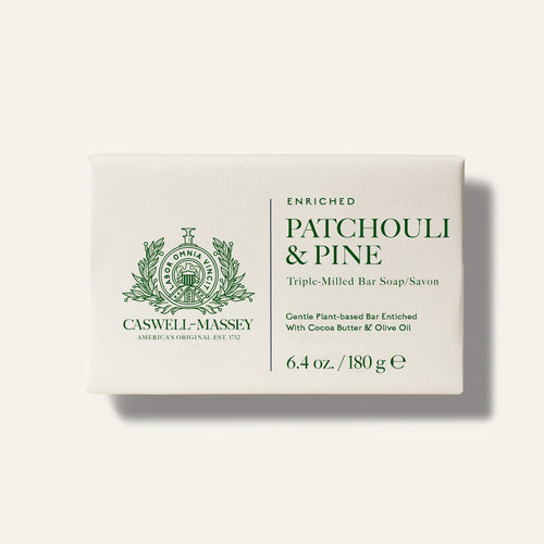 A rectangular white package labeled "Caswell-Massey Patchouly and Pine Bar Soap." This 6.4 oz plant-based, triple-milled soap is enriched with cocoa butter and olive oil.