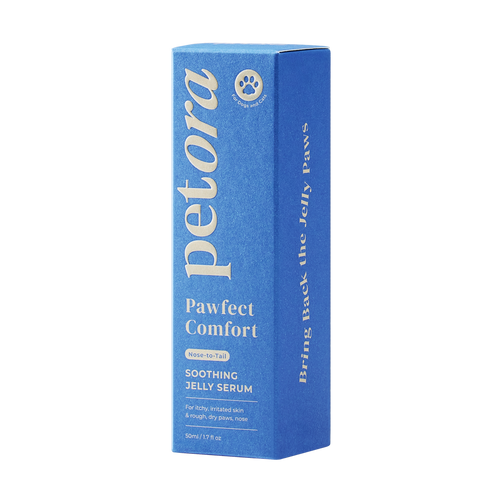 A blue rectangular box of Petora PAWFECT COMFORT Nose-to-Tail Soothing Jelly Serum for pets, with white and gold text, a paw print icon on the top left, and centella asiatica to help soothe irritated pet skin. Brand: Petora.