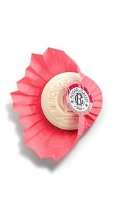 A set of three Roger & Gallet Red Ginger Wellbeing soaps (3 x 3.5 oz), each wrapped in pleated pink paper with a white and gold label, crafted in France using naturally derived ingredients.