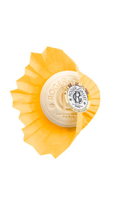 Round package of Roger & Gallet Orange Wood - Wellbeing Soap - 3.5 oz, displaying the brand's logo and French text, on a white background. The packaging is orange and beige with black text featuring notes of Petit.