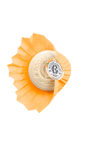 A round bar of Roger & Gallet Neroli - Wellbeing Soap - 3.5 oz with an orange and white package design, featuring the brand's logo in the center and details in black and gold lettering.