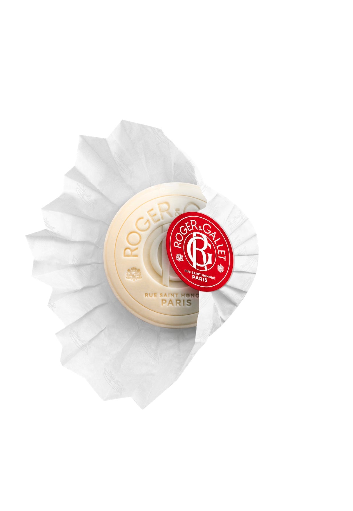 A Roger & Gallet Jean Marie Farina perfumed soap in white and red packaging, displayed against a black background. The soap is circular, segmented.