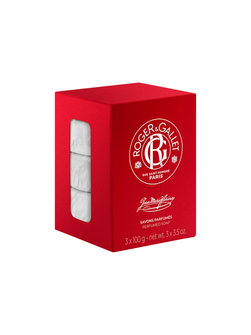 A red Roger & Gallet Jean Marie Farina soap box with a clear window showing three bars of perfumed soaps inside. The box features white text and branding details, emphasizing its Parisian origin.